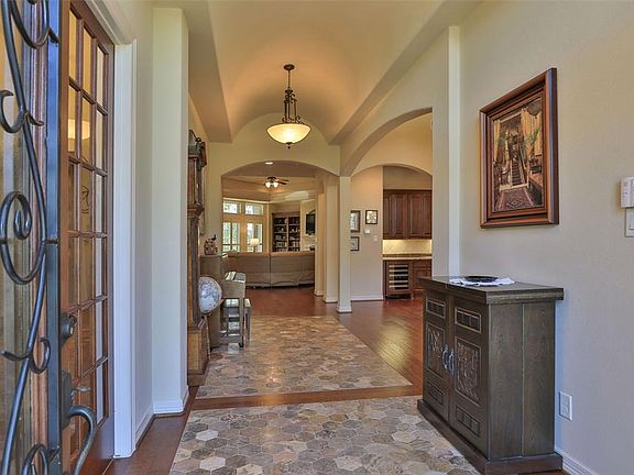 What an entry...wide and look at the barrel vaulted ceiling that runs the whole length! There is a large study off to the left and the dining area is off to the right.