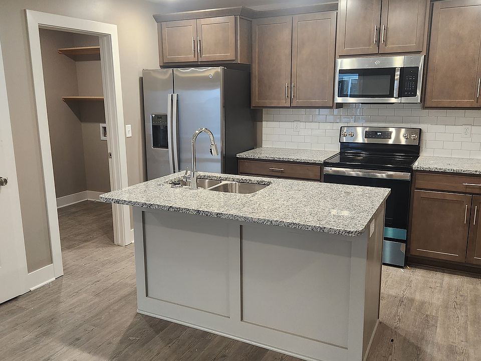Kitchen with island and eating bar