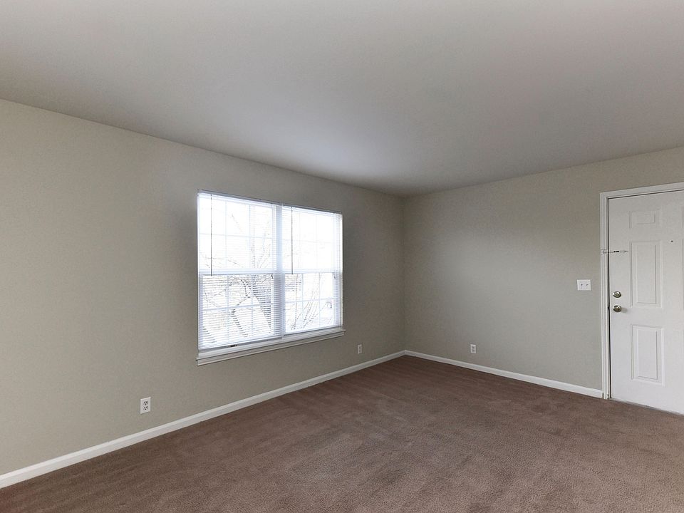 Spacious living room with carpet