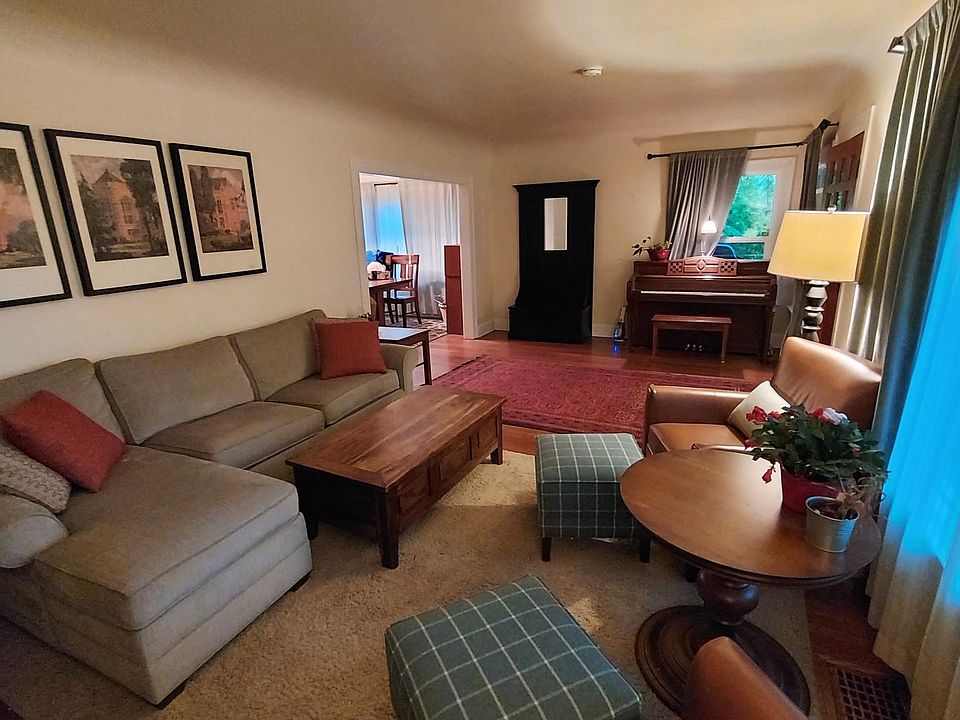 Large living room with coved ceiling and fireplace