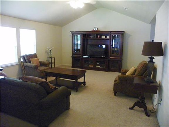 High ceilings and lots of windows make the home feel even larger.