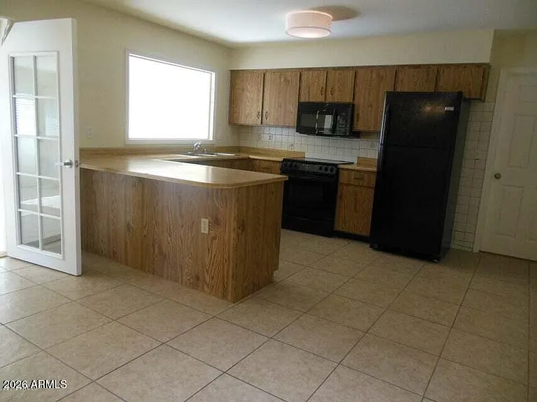 7203 W Hatcher Rd — Photo 2