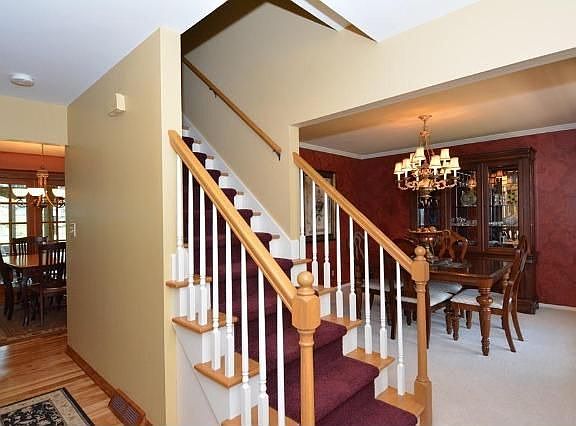 WELCOMING FOYER W/RICH HWF!