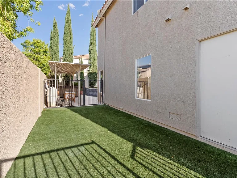 Large turfed side yard greater for kids to play! (Gated on both ends)
