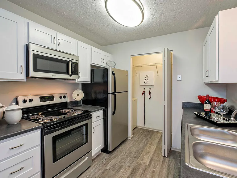 Stainless Steel Appliances and White Cabinetry