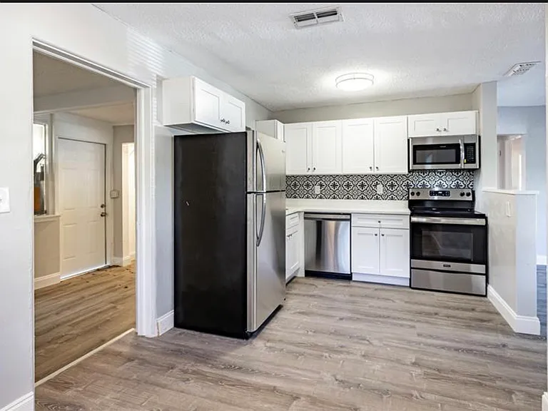 Kitchen complete with dishwasher, disposal, stove/oven, microwave