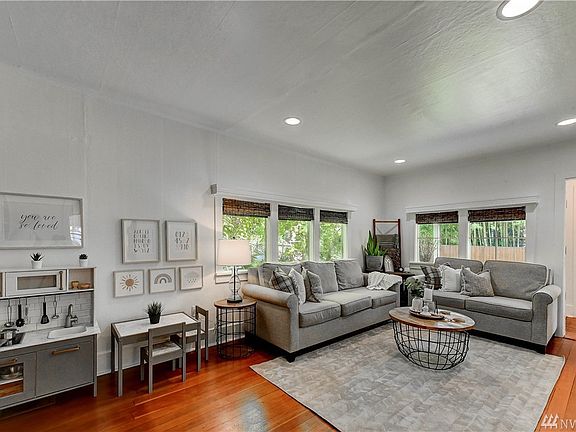 Gleaming hardwood floors and new window blinds.