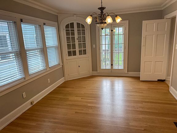 Formal dining room also has hardwood floors plus a large built in corner china cabinet
