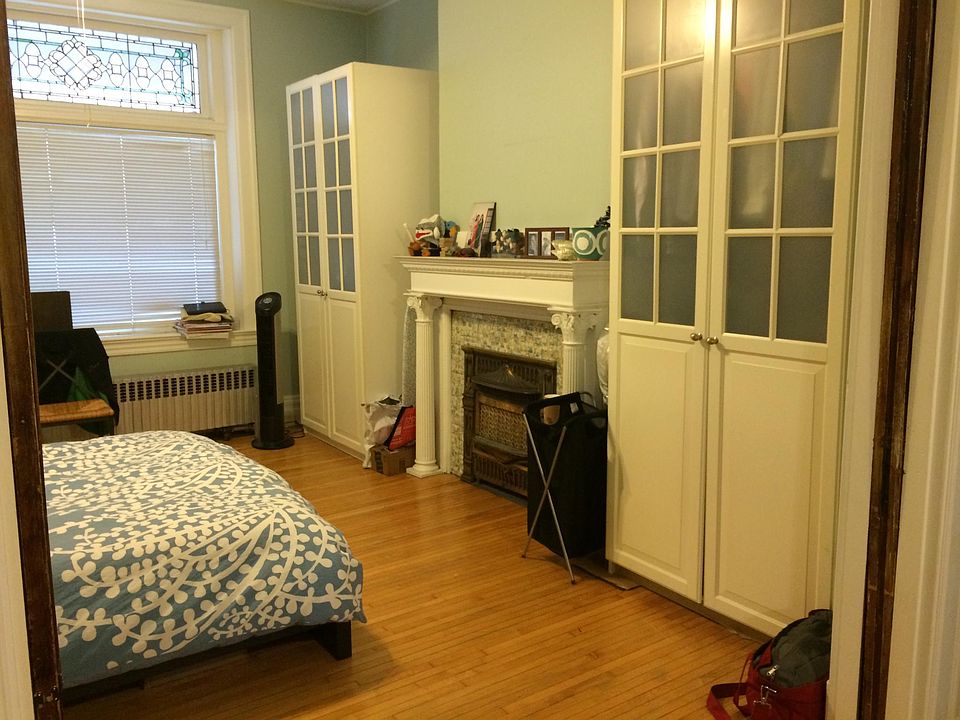 Large, comfortable bedroom with a beautiful decorative fireplace and two large wardrobes. Working pocket doors for privacy