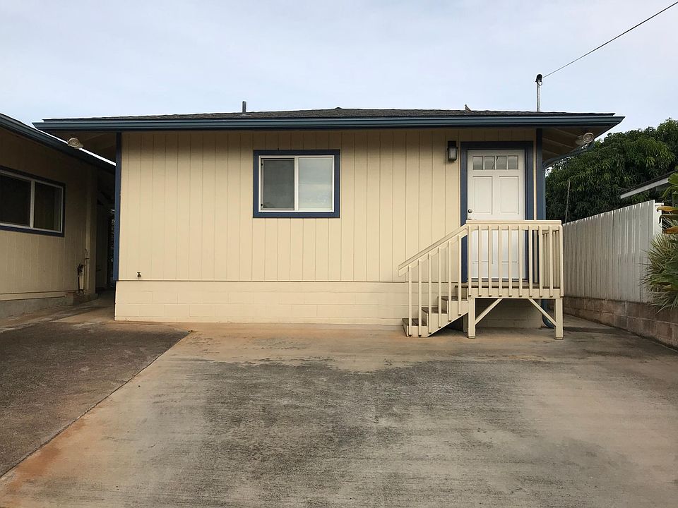 Front view (up sloping driveway). Tandem parking on right side of driveway in front of stairs & front door.