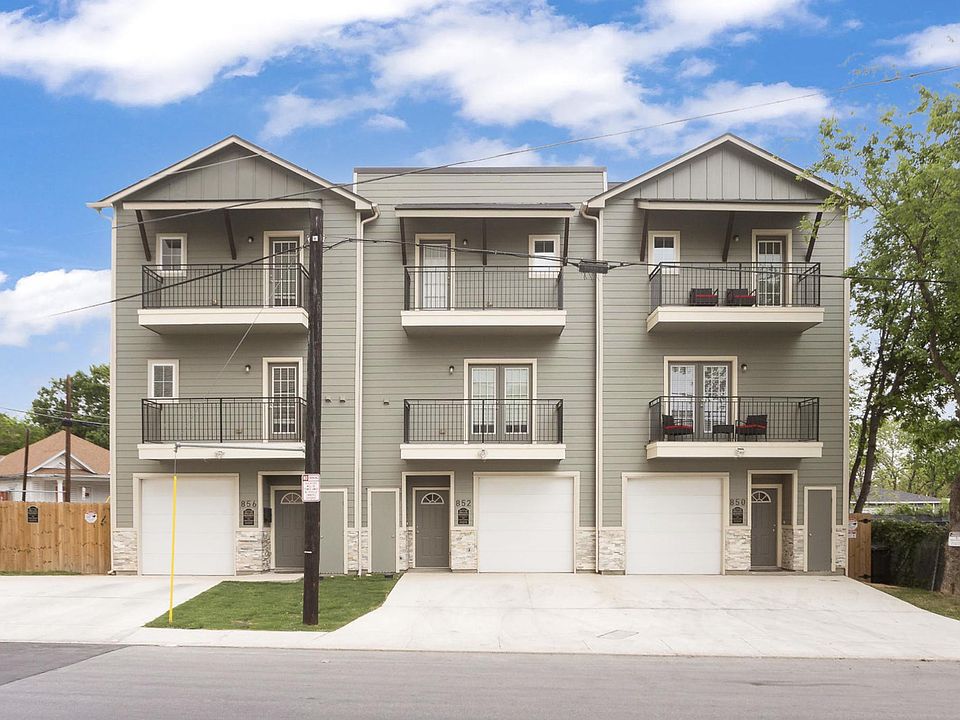 Photo of three (3) separate townhomes on E Erie Ave.