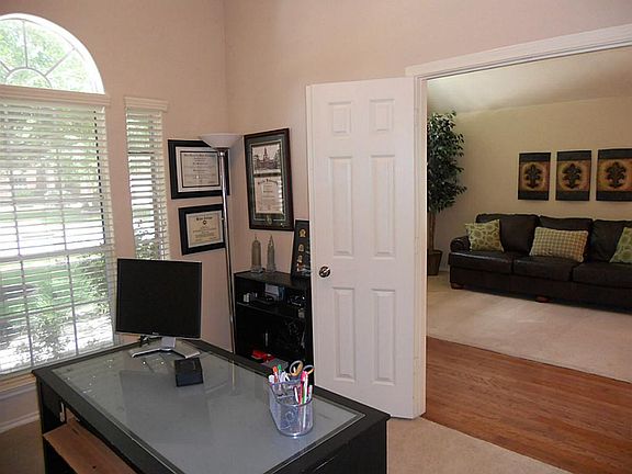 Study off the foyer that may be utilized as a 4th bedroom.