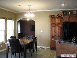 view of dining room into family room from living room