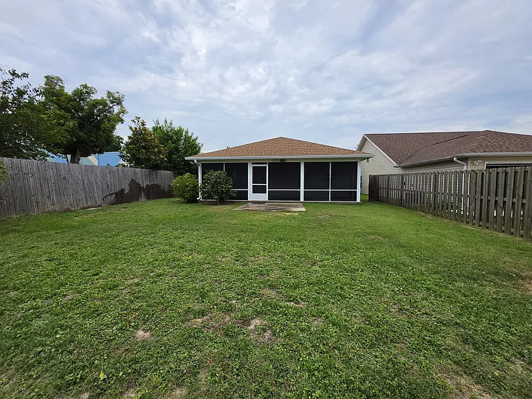 Backyard is completely fenced in