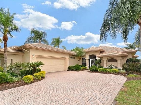 Attractive Brick Driveway and Side Entry Garage