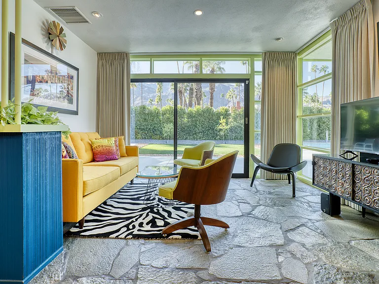 TV den with view to backyard. Flat screen Smart TV.