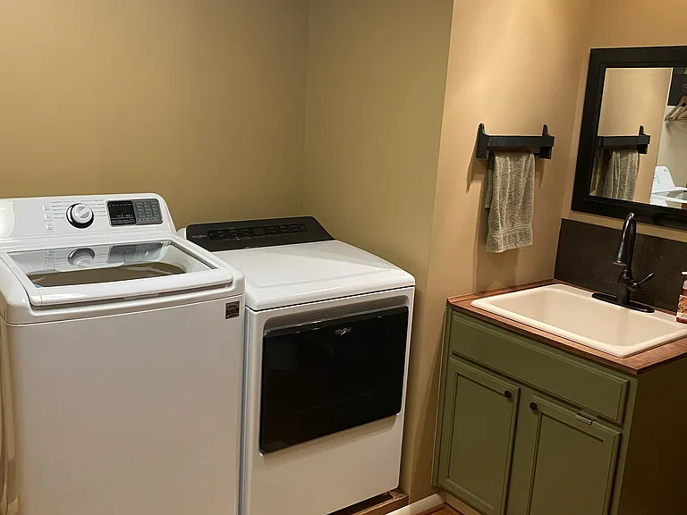 (2 of 3) half bath/laundry room.