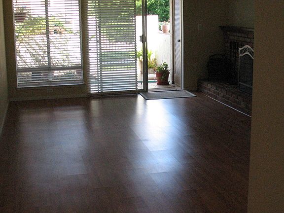 living room mw/wood burning fireplace/open to patio
