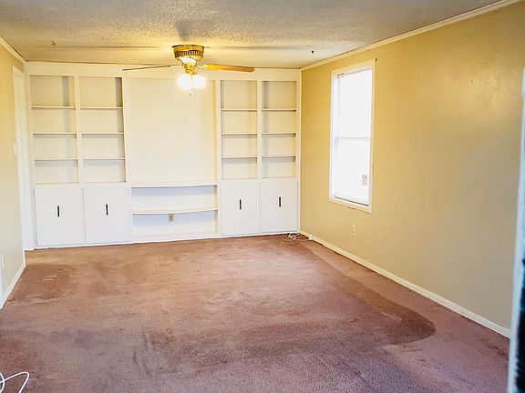Spacious living room with built ins
