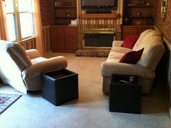 Family room with gas log fireplace and built-in bookshelves