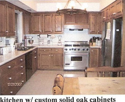 Solid oak cabinets, Viking 6 burner with griddle stove. 11x19