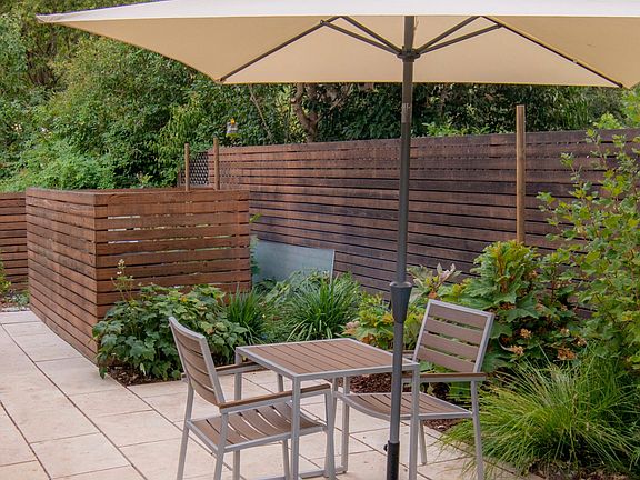 Private patio with table and chairs and Sunbrella tilting umbrella. Char-Broil propane gas barbecue for your exclusive use.