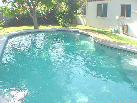 Back Of Home, Heated Pool that is heated by Solar Panels On the Roof.