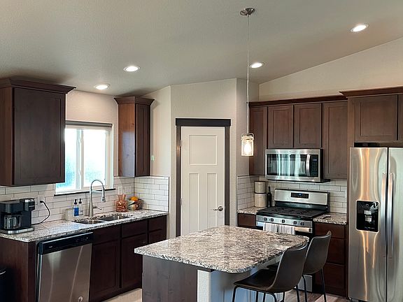 Kitchen with island and walk-in pantry