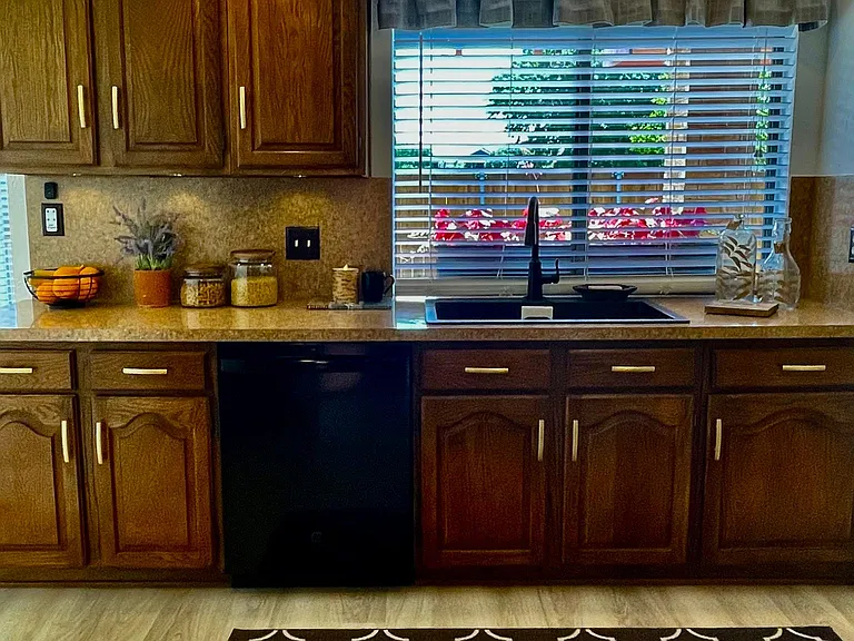 Kitchen view from dining room/ bonus room
Kitchen window over looks back yard covered garden patio
Solid wood cabinetry.