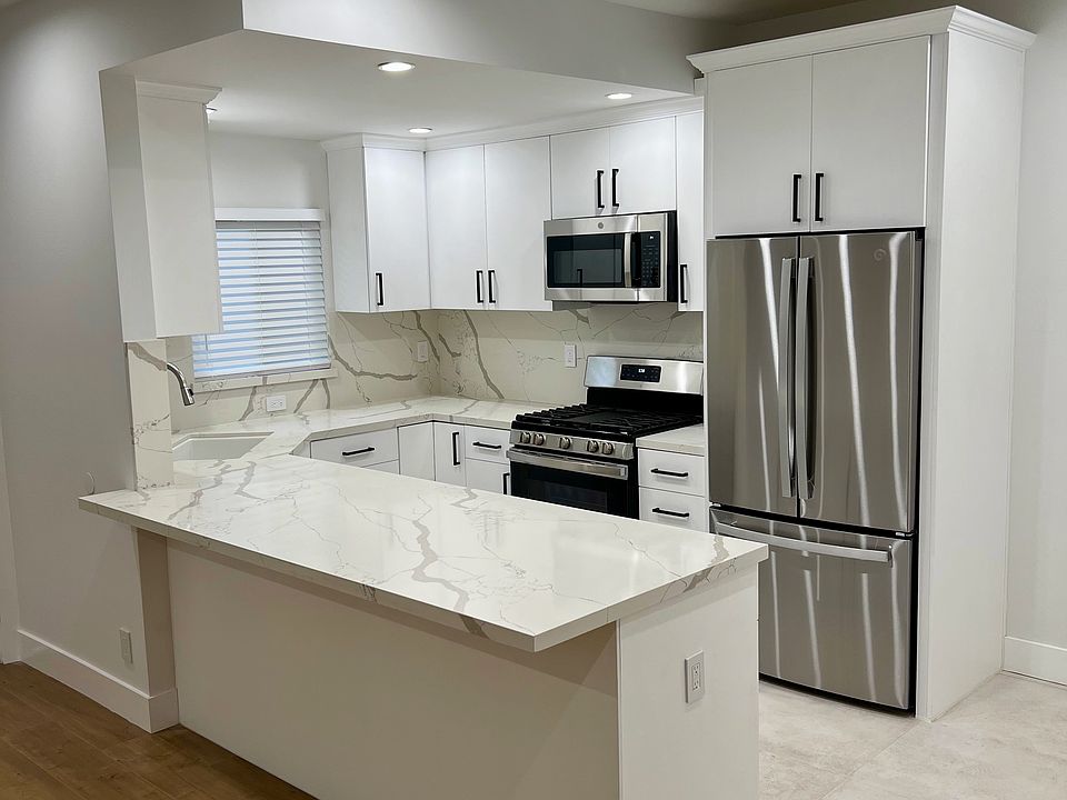 Completely Remodeled Top of the Line Kitchen - Stone Counters Custom Cabinets and Stainless Steel Appliances