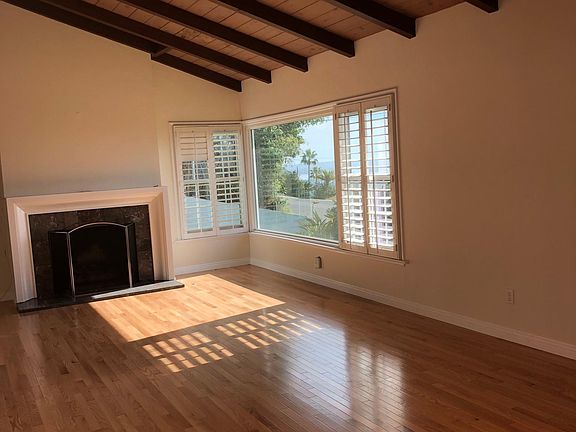 Living Room with ocean and city views