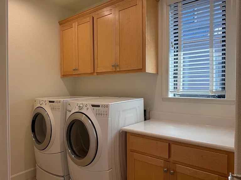 Laundry room is conveniently located on the second floor.
