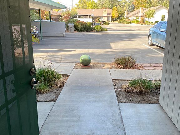 Nice front porch area with solid security door...