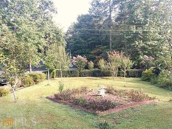front yard flower garden and fruit trees