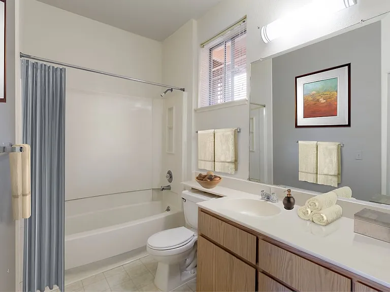 Classic Package I bath with light oak cabinetry, white laminate countertops, and hard surface flooring