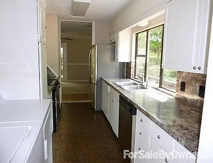 Kitchen w/new stainless steel appliances
						:
						new Formica countertops, large window with view of yard, washer/dryer included