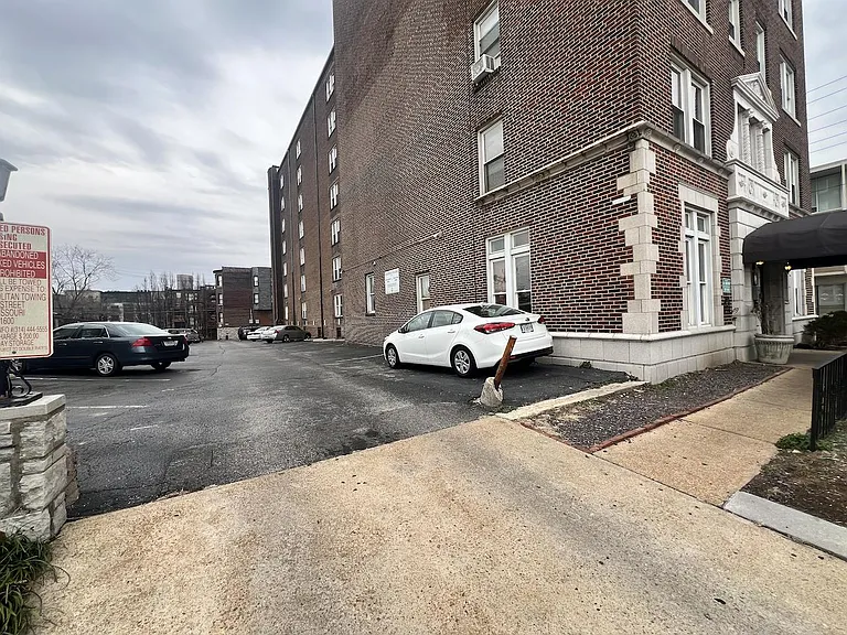 Parking lot adjacent to building.