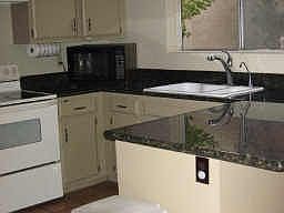 New granite & tons of cabinets!