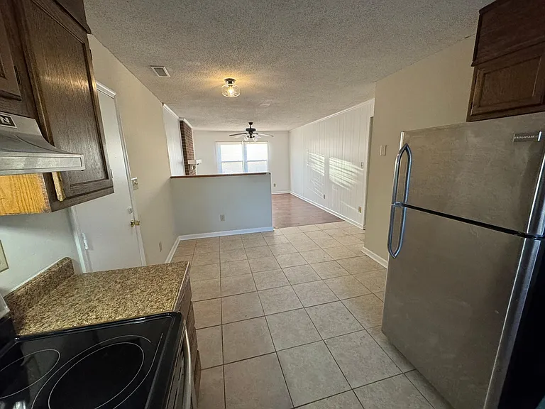 View from Kitchen to Main Living, Eat-In Kitchen (before cabinets were painted white)