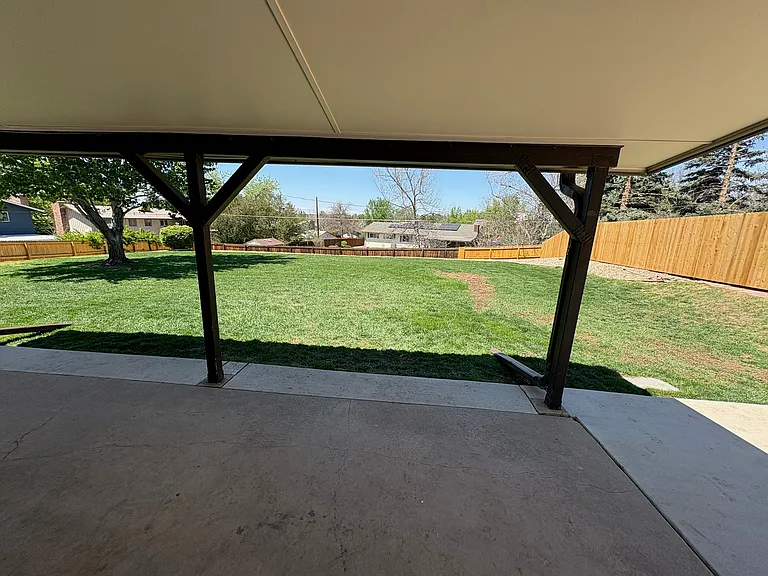 covered back patio, large fully fenced backyard (lawncare included in rent)