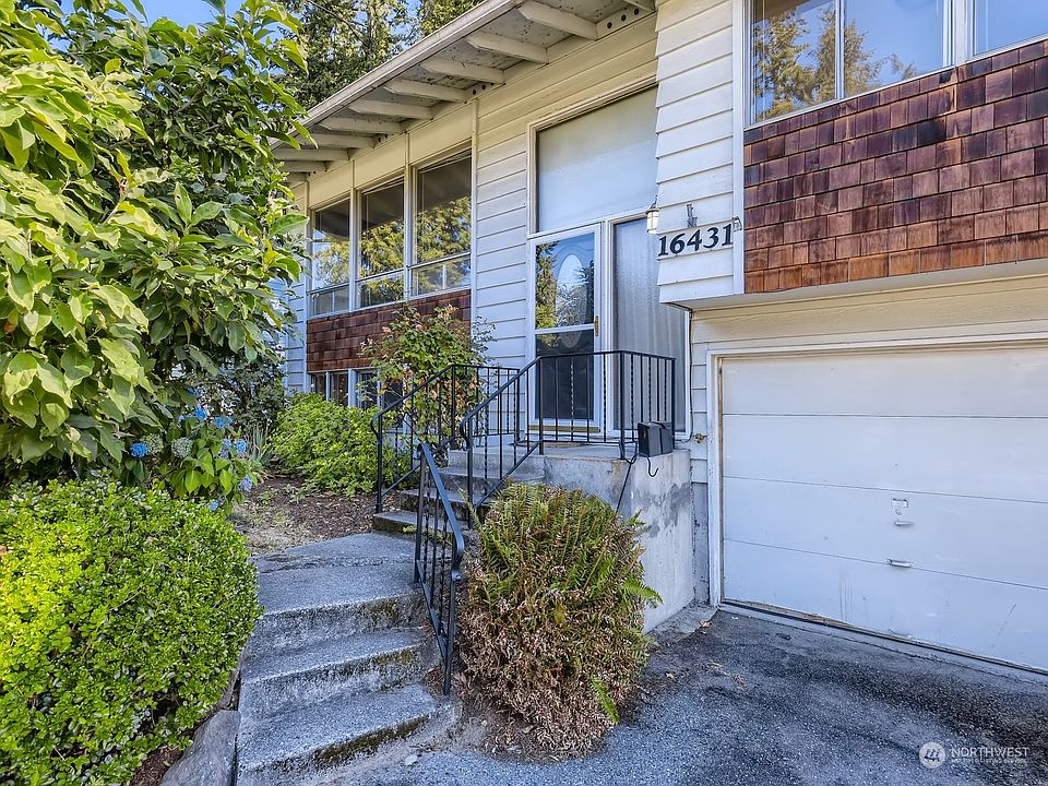 This home features more than meets the eye...featuring mid century charm upstairs and some fun remodeled features downstairs!>