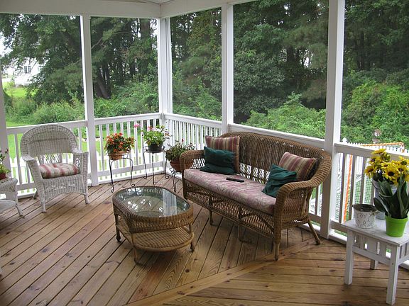 12' x 24' screened porch overlooking fenced back yard which backs up to woods