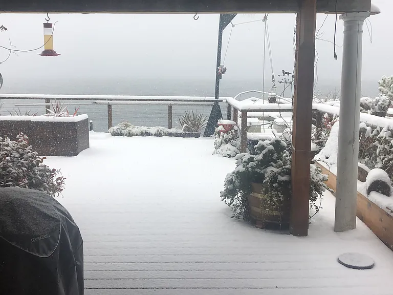 Winter snow on deck. Snow is rare on the beach.