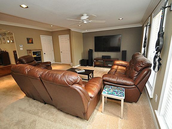 Cozy family room wired for surround sound. 1st door leads to garage, 2nd door is the 1/2 bath