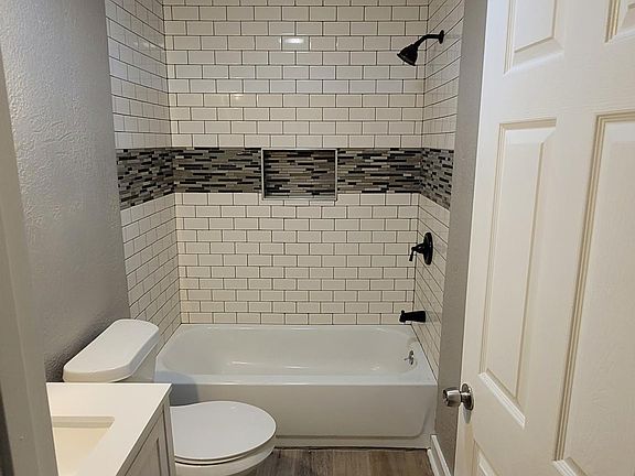 Subway tiled shower all the way to ceiling!