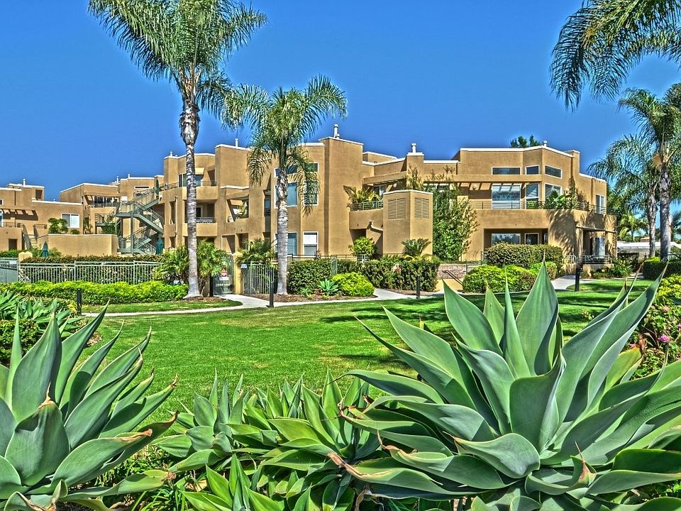 This is the exterior of this beautiful gated community. This home sits on the bottom floor in front of the pool facing the lagoon plus has a ocean view from the living room and covered patios.