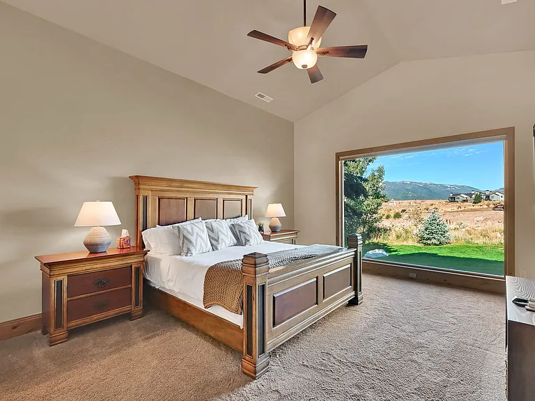 Master bedroom with king bed, smart TV, private master bathroom, and smart tv with incredible views and natural light