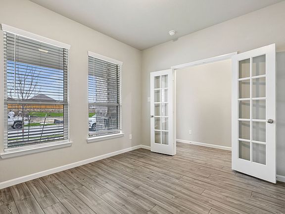 REPRESENTATIVE PHOTO - Study Home Office in the Stanley home plan by Trophy Signature Homes