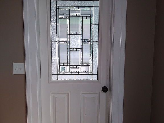 Door to screened in porch.