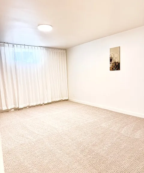Bright and spacious room A, 180 sqft. with 2 wall art and a big closet. Window facing west street.